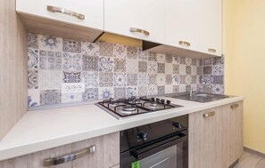 Fridge, stovetop, dishwasher, coffee/tea maker