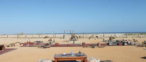 On the beach, white sand, free beach cabanas, sun-loungers