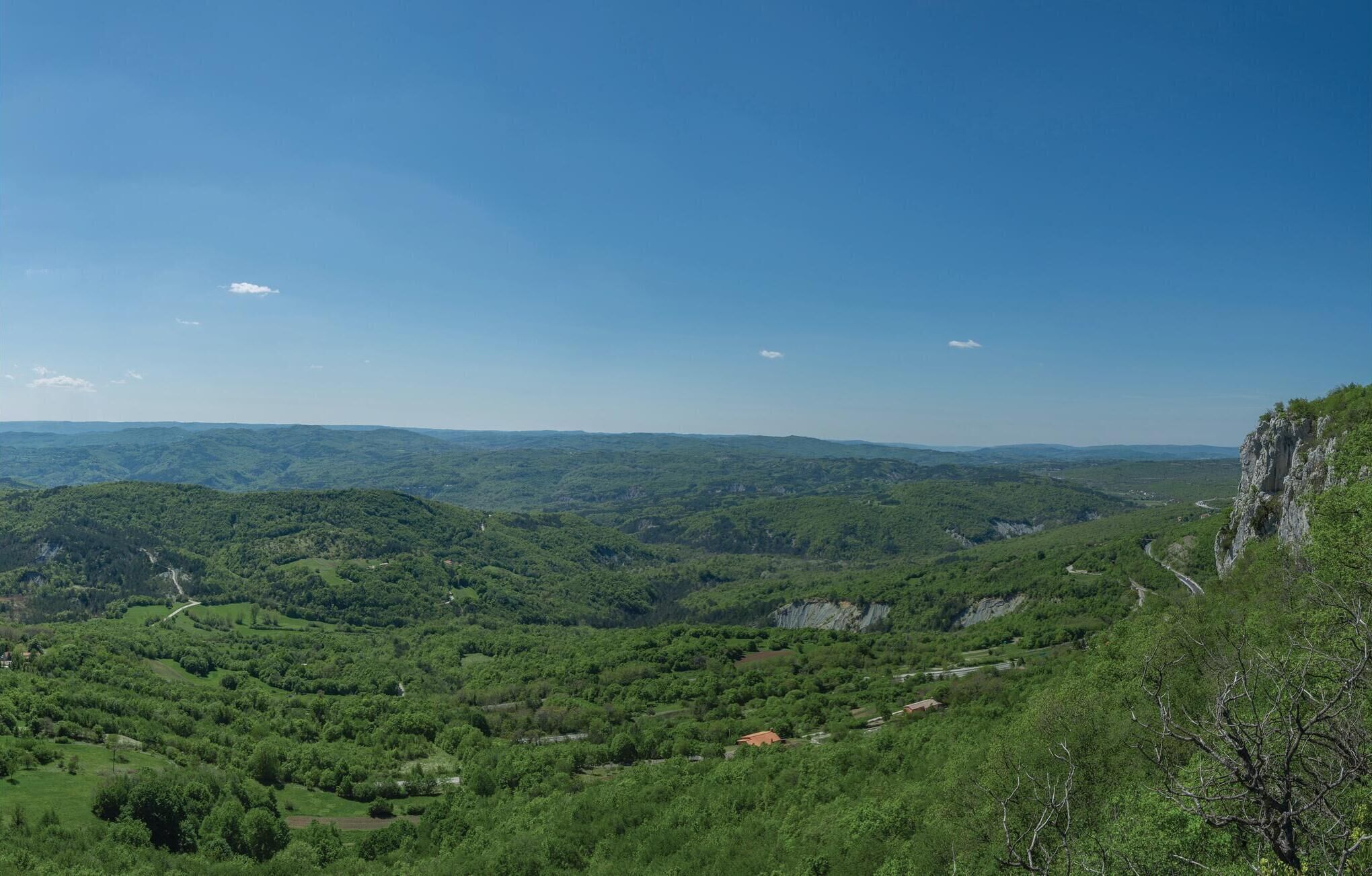 A mountainous landscape with a clear sky.