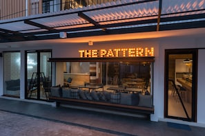 A modern building with a sign reading "THE PATTERN".