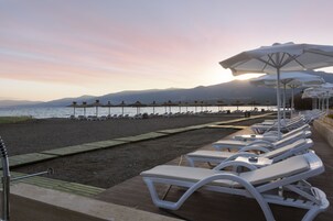 Private beach, sun loungers, beach umbrellas, beach volleyball