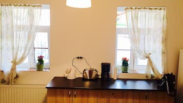 Basic Apartment, 2 Bedrooms (common yard) | Private kitchen | Fridge, oven, stovetop, coffee/tea maker