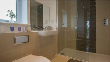 Executive Apartment, 2 Bedrooms | Bathroom | Shower, free toiletries, hair dryer, slippers