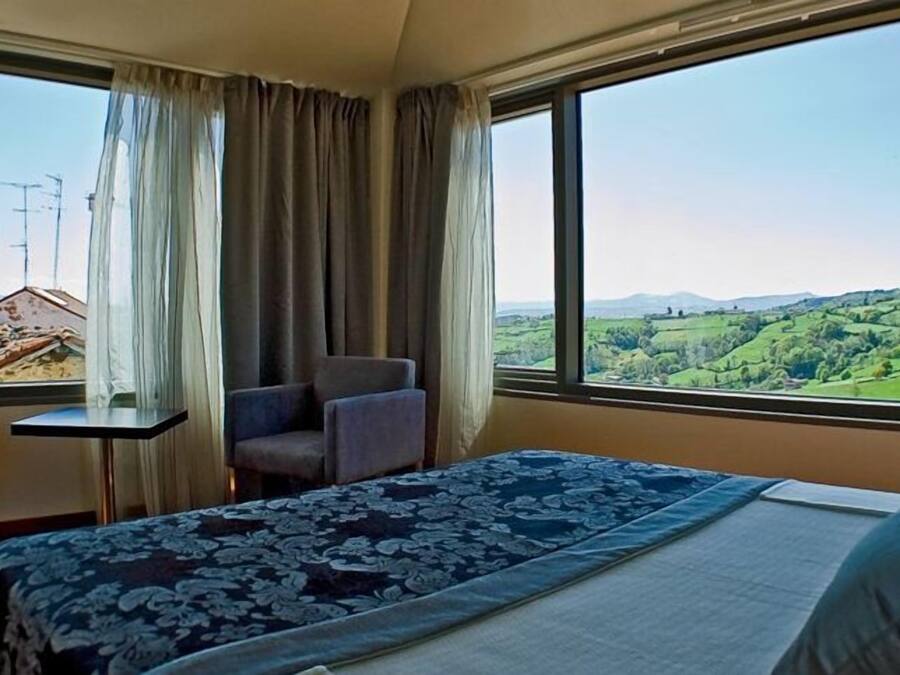 Minibar, desk, blackout curtains, iron/ironing board