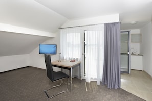 Double Room | Living area | Flat-screen TV, pay films