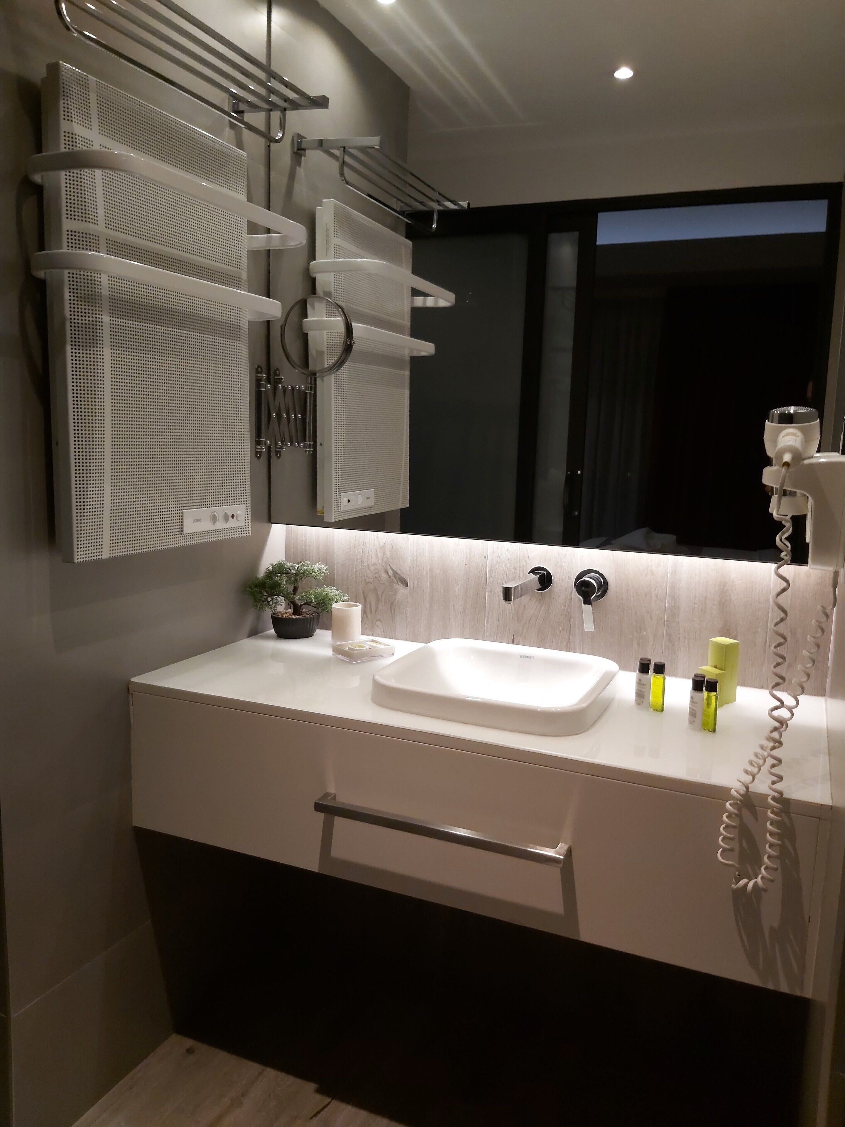 senior city view with balcony | bathroom | shower, rainfall showerhead, eco-friendly toiletries, hair dryer