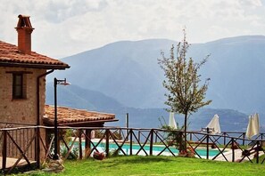 Seasonal outdoor pool, pool umbrellas, pool loungers