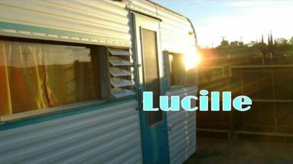 A trailer with a window and the word "Lucille" visible.