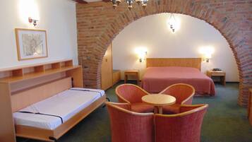 Triple Room | Minibar, in-room safe, desk, iron/ironing board