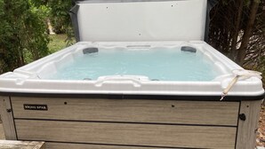 A hot tub with a wooden exterior and a label reading "VIKING SPAS." - The Lake Geneva Lakehouse (Williams Bay)