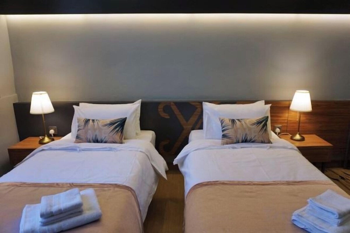 Premium bedding, desk, iron/ironing board (on request), WiFi (free)