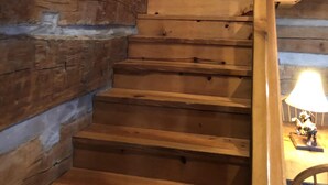 A wooden staircase in a log cabin interior. - Rustic Log Cabin next to the Hoosier National Forest in the Ohio River Valley (Derby)