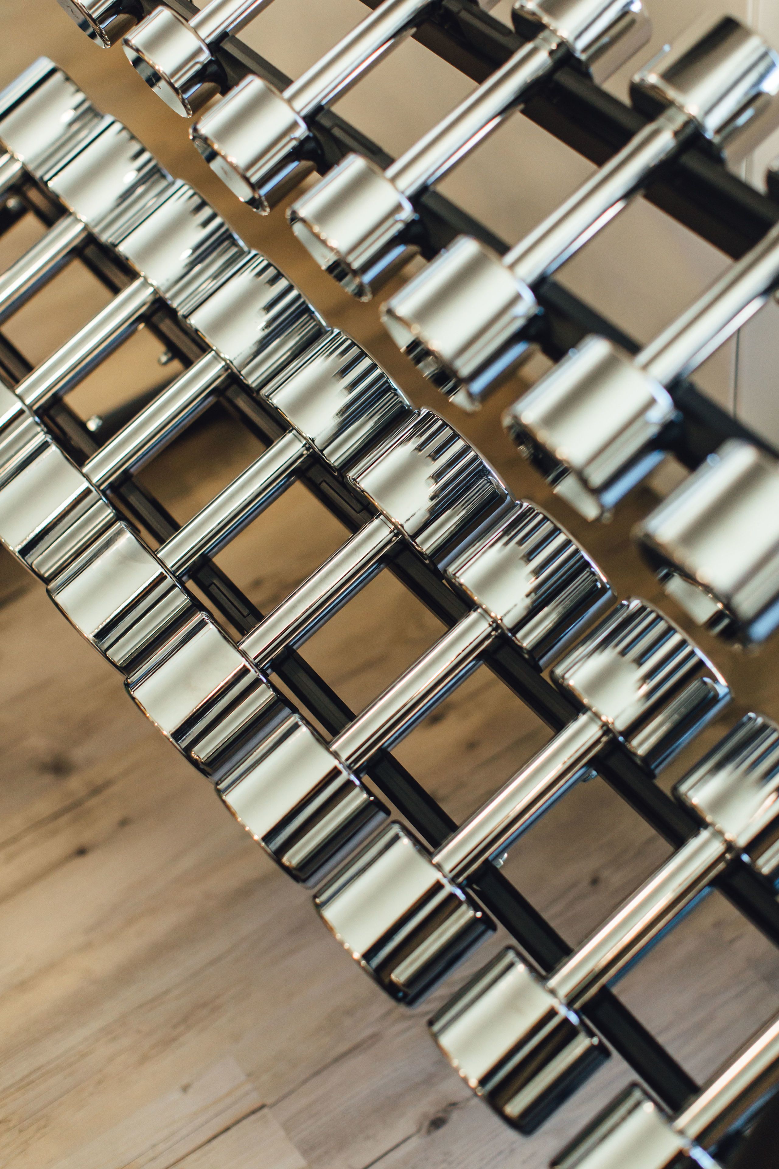 A close-up of a metallic, interlocking chain-like structure.