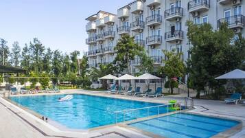 Outdoor pool, open 8 AM to 6 PM, pool umbrellas, pool loungers