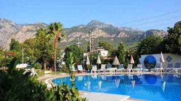 Outdoor pool, open 8 AM to 6 PM, pool umbrellas, pool loungers