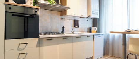 Apartment, 1 Bedroom | Private kitchen | Fridge, microwave, stovetop, coffee/tea maker