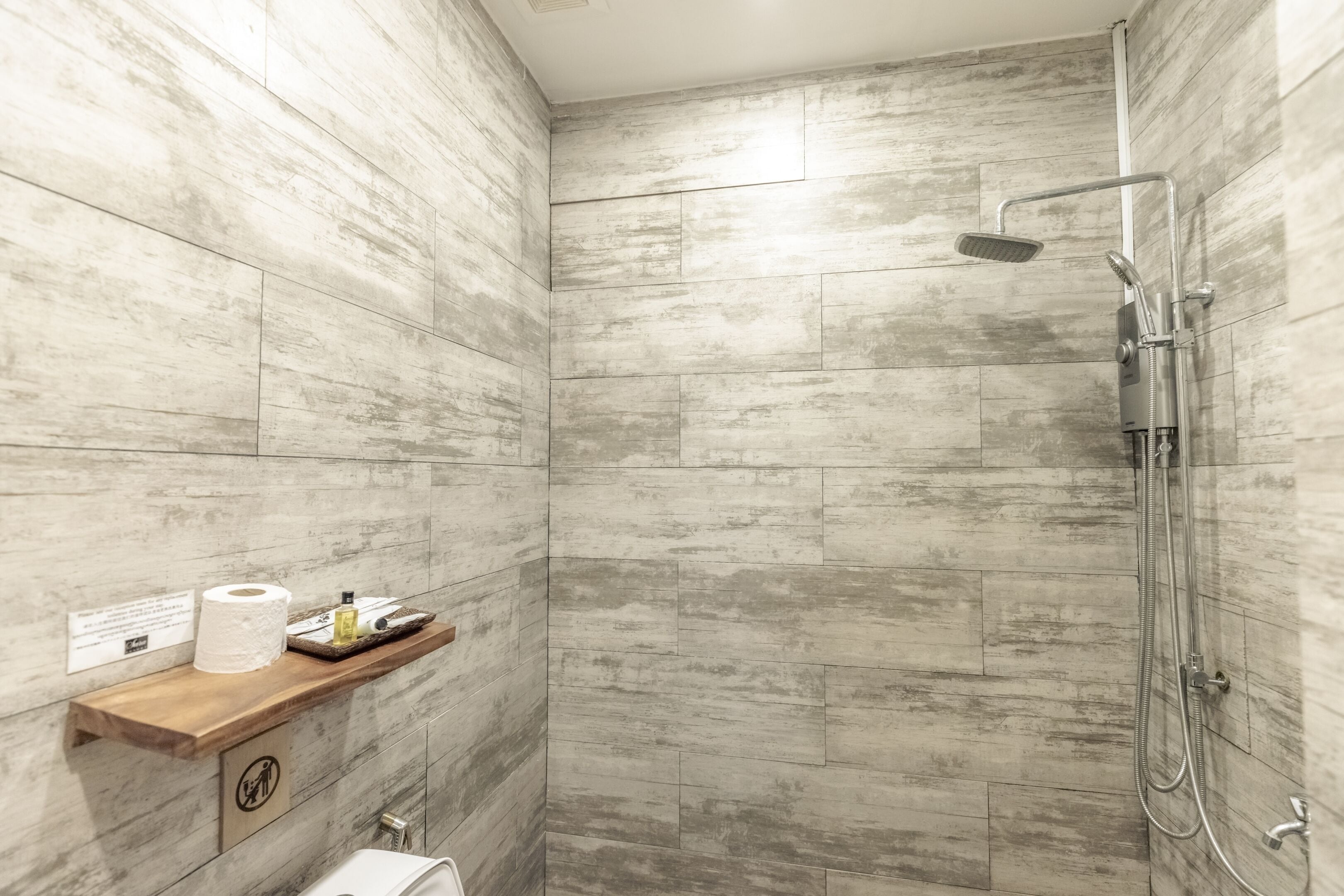 deluxe family room garden view | bathroom | shower, free toiletries, hair dryer, towels