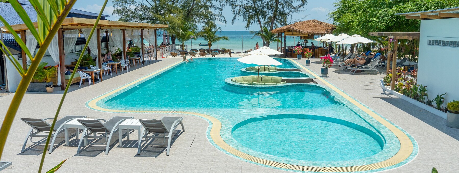 Outdoor pool, open 7:00 AM to 10:00 PM, free pool cabanas