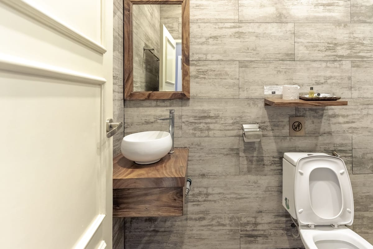 superior beach view family suite | bathroom | shower, free toiletries, hair dryer, towels