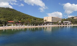 Guests can enjoy a serene beachfront setting with access to a sandy beach and lush surroundings.