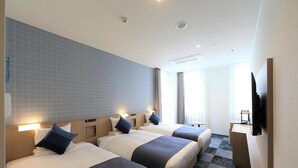 A hotel room with three beds, a desk, a television, and a large window. - Okayama Business Hotel Annex (Okayama)