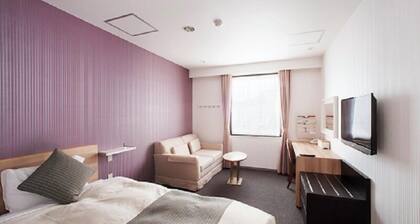 K. M. H Art Hotel by Kure Morisawa