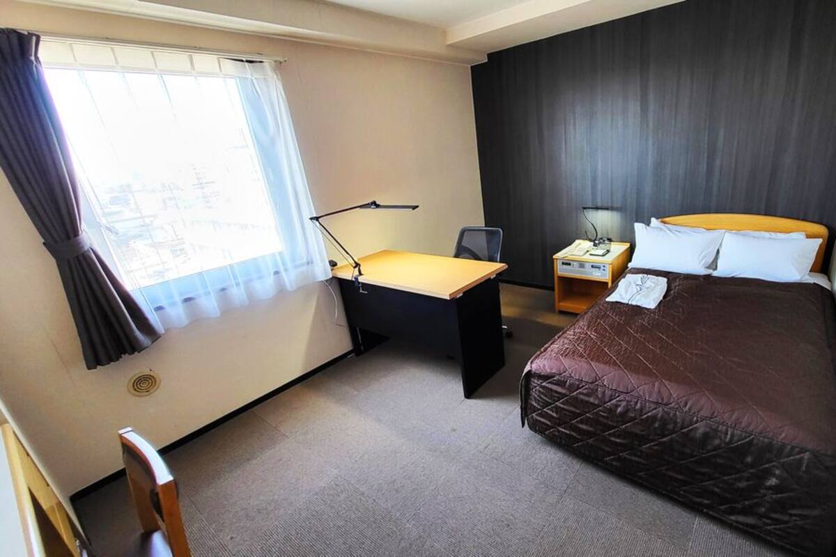 Down duvets, desk, laptop workspace, blackout curtains