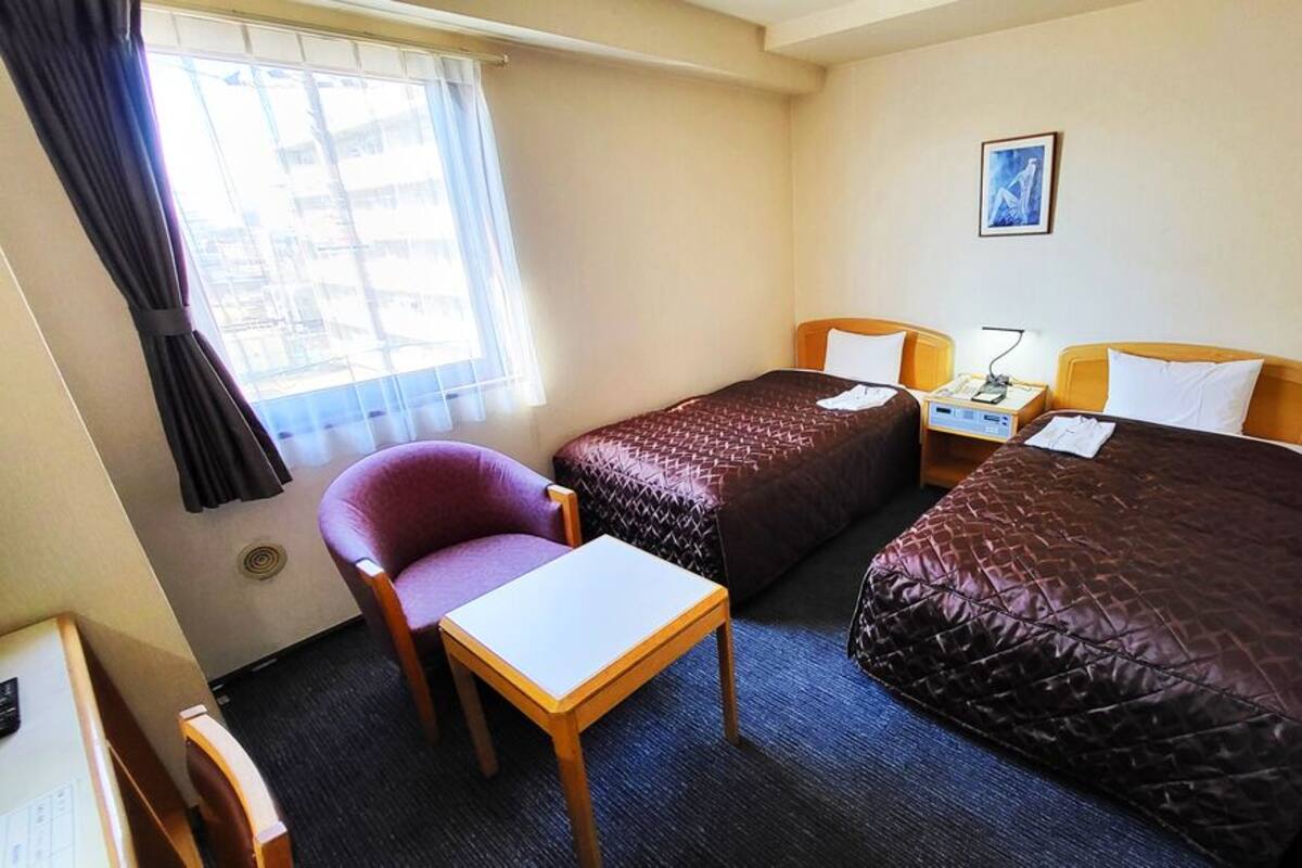 Down duvets, desk, laptop workspace, blackout curtains