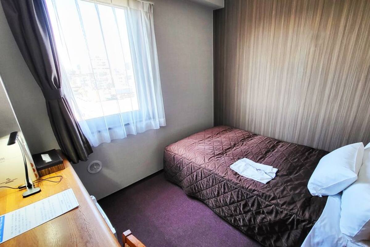 Down duvets, desk, laptop workspace, blackout curtains