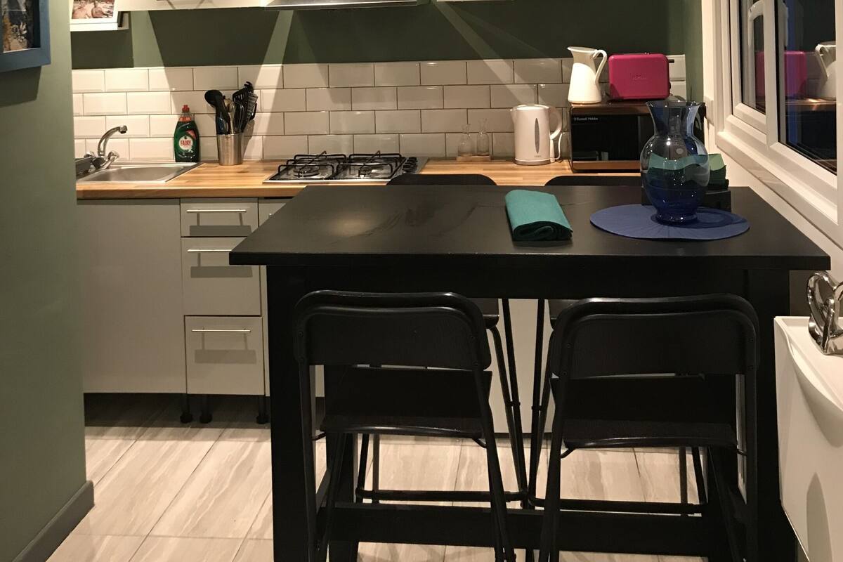 Basic Apartment, Ensuite, Garden View (Garden Annexe) | Private kitchen | Highchair