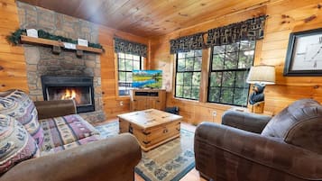 Cabin, 1 Bedroom | Living area | Flat-screen TV, fireplace