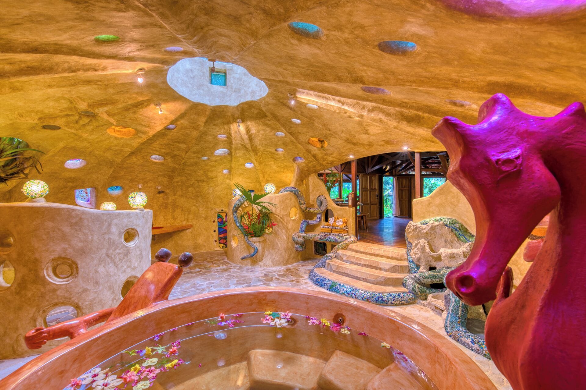 A luxurious interior with a central hot tub, unique architectural design, and a vibrant atmosphere.