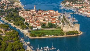 A coastal town with a historic castle, marina, and dense residential area. - Luxury villa with private heated pool and sea view 3 (Marina)