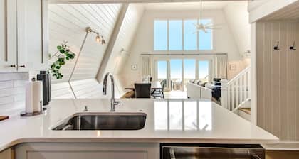 Roomy Chalet-Style Beachfront Condo with Private Beach Access by RedAwning