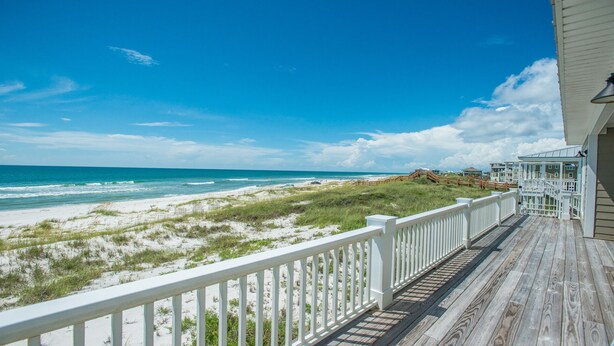 A wooden deck with a white railing overlooking a beach with dunes and ocean. - North end of Cape Gulf Front 1 level w/elevator from carport & screened-in porch (Cape San Blas)