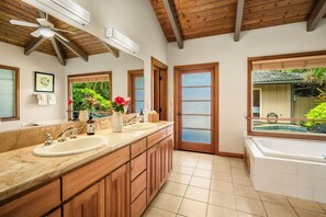 A spacious bathroom with a large vanity, a bathtub, and a ceiling fan. - Tropical Zen Oasis -Waterfall Plunge Pool - AC (Princeville)