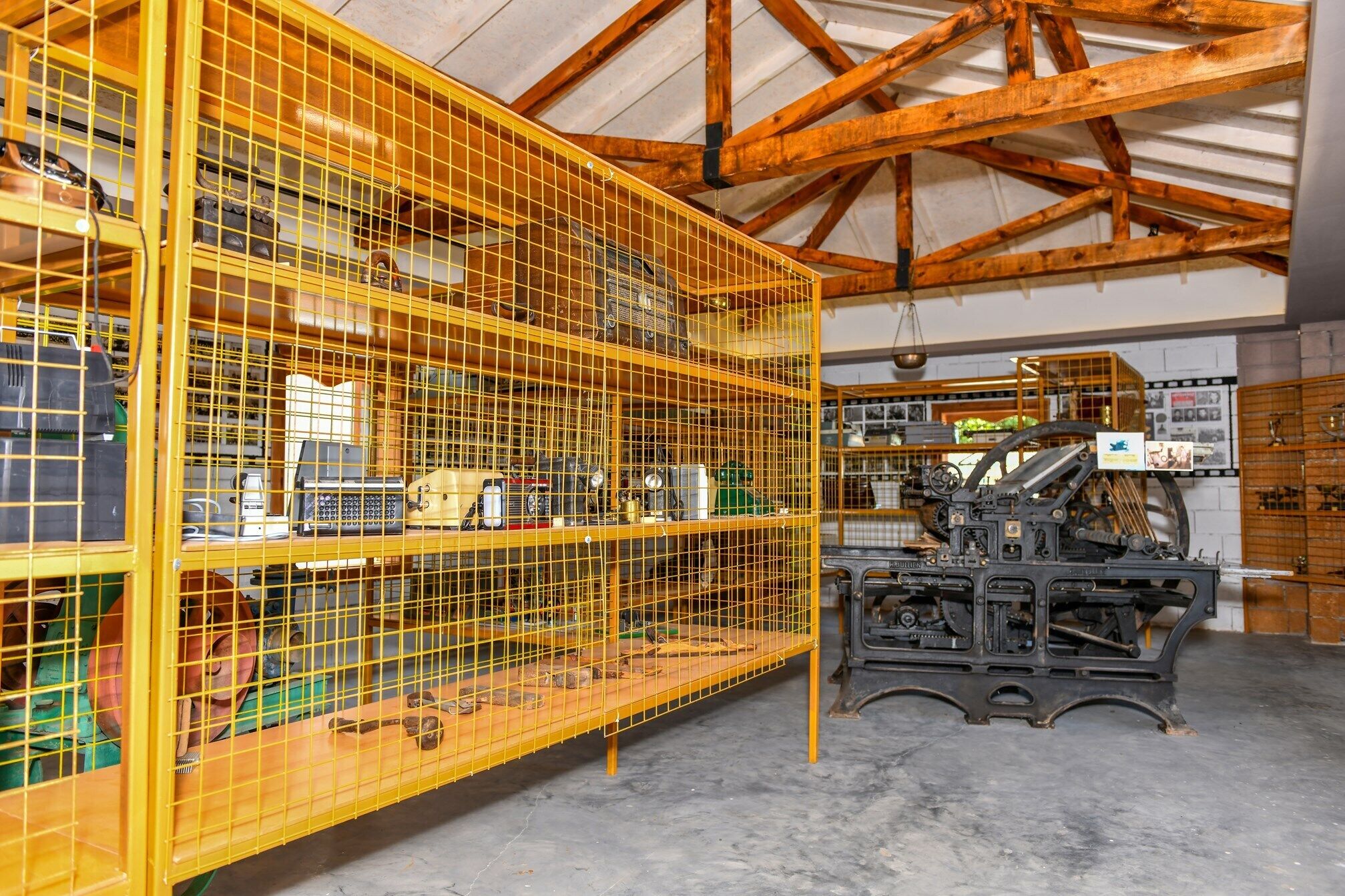 A large industrial space with metal shelving units filled with various mechanical parts and tools.