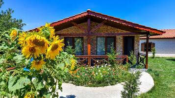 Standard Villa, 1 Bedroom, Kitchenette, Garden Area | 1 bedroom, desk, soundproofing, iron/ironing board