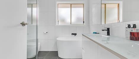 Bathtub, hair dryer, towels