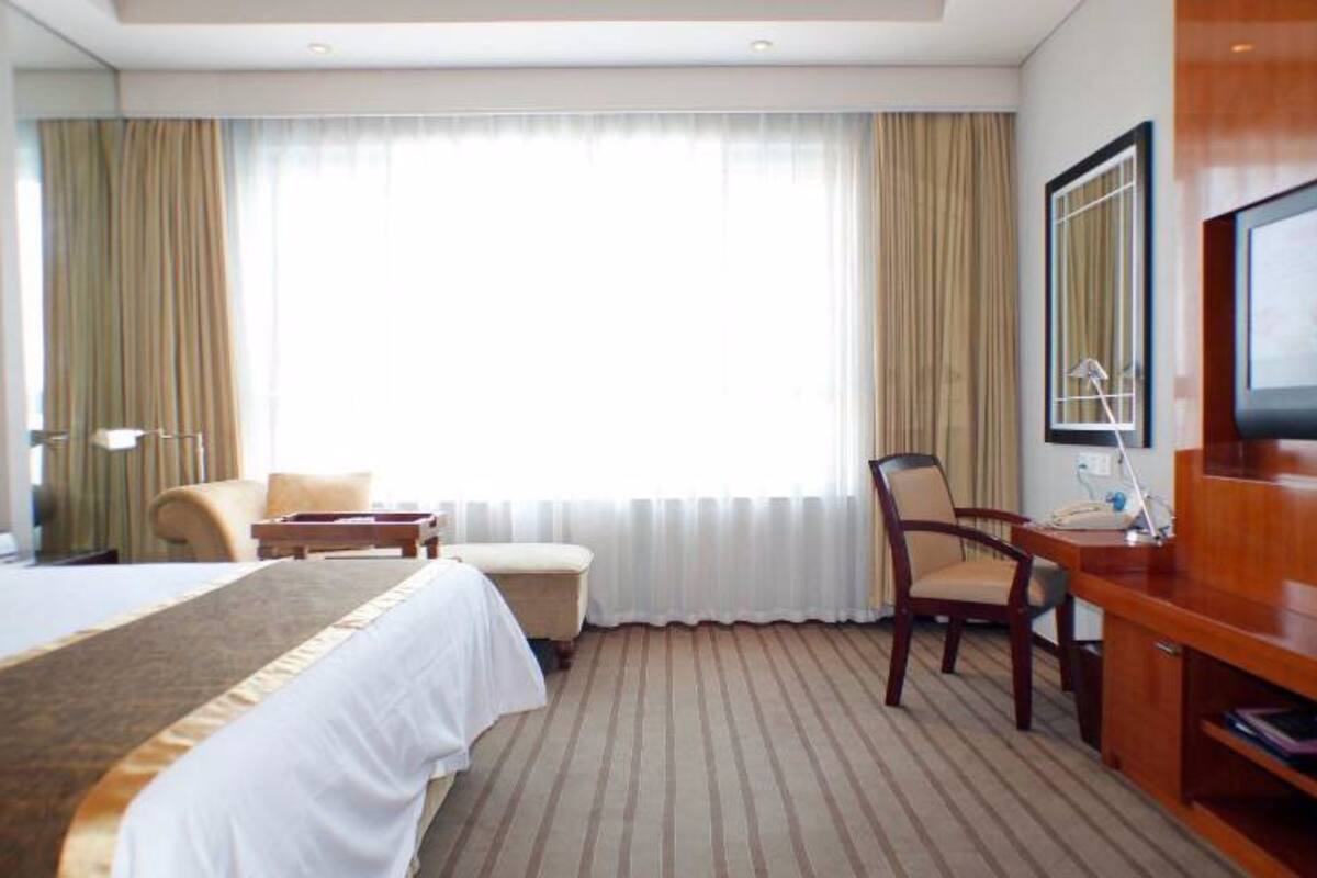 Suite exécutive | Minibar, coffre-fort, bureau, rideaux d’obscurcissement