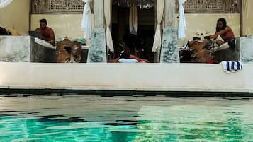 Outdoor pool, free cabanas, pool umbrellas