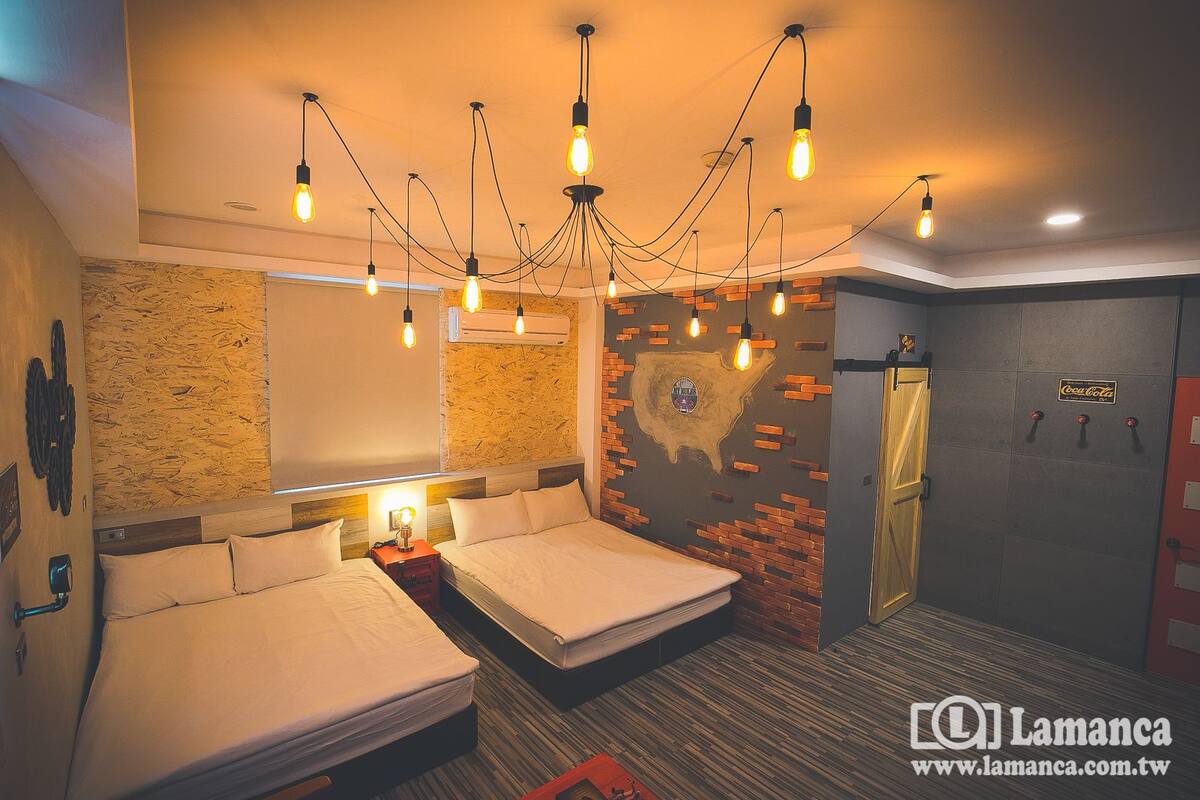 Habitación cuádruple Deluxe, 2 camas matrimoniales | Ropa de cama de alta calidad, edredón y camas con pillow-top