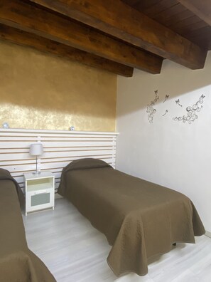 Comfort Quadruple Room, Courtyard View | Minibar, in-room safe, desk, soundproofing - La Nuova Girgenti (Agrigento)