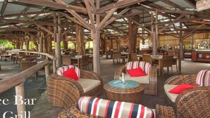 A restaurant with wicker furniture and a wooden ceiling structure. - C215 Ramada Resort Deluxe King - Free Wifi (Port Douglas)