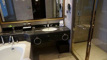 Separate bathtub and shower, free toiletries, hair dryer, slippers