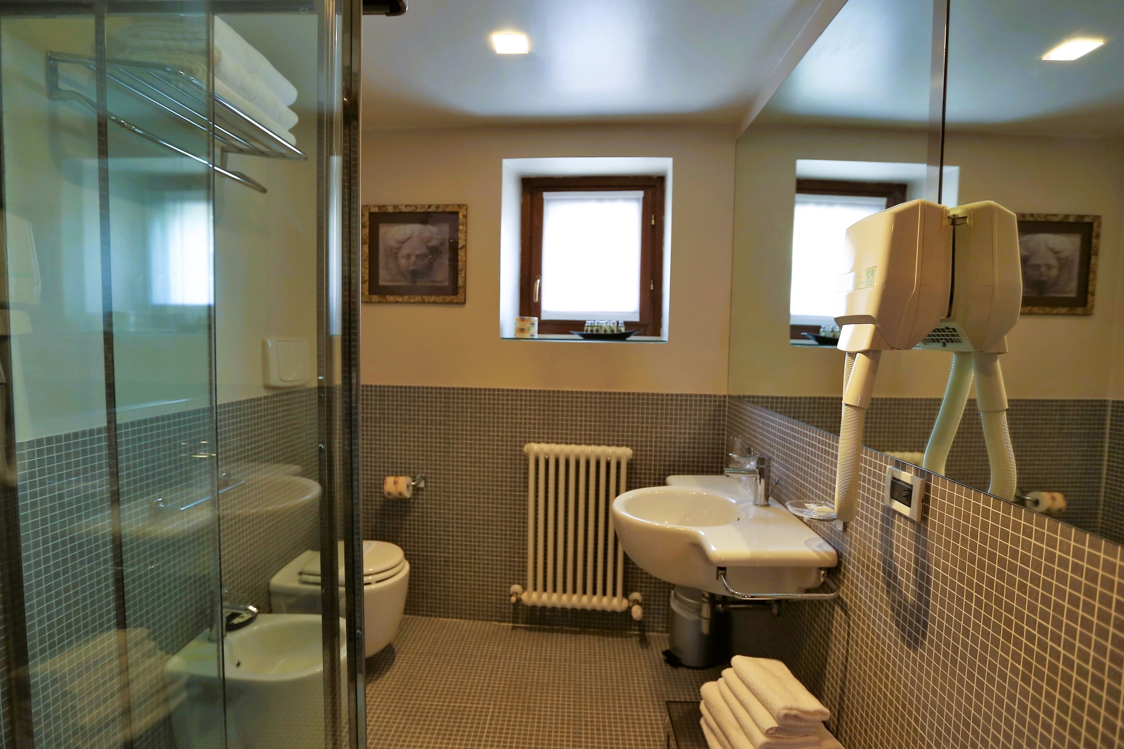 superior triple room | bathroom | shower, hair dryer, bidet, towels