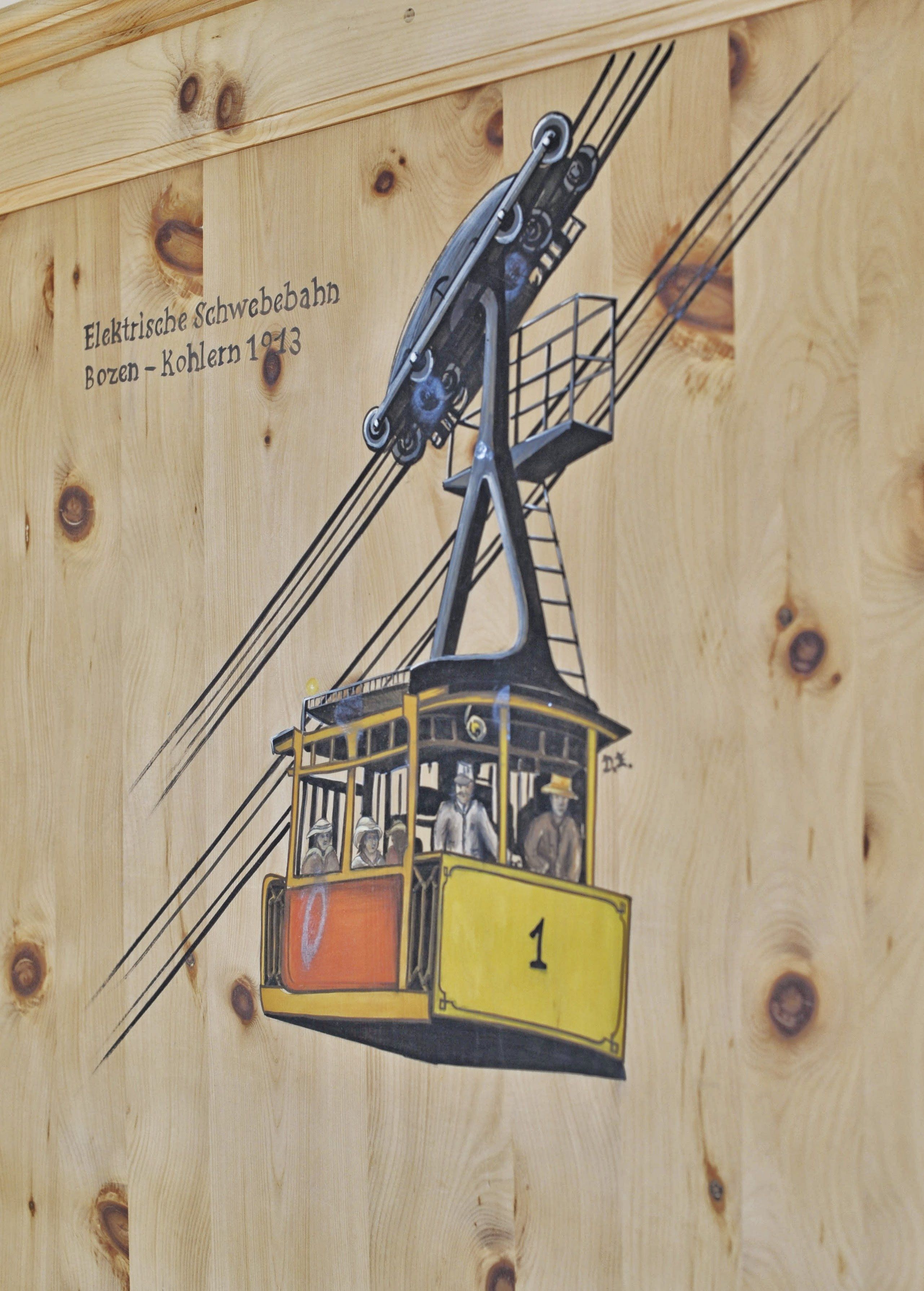 A wooden cabin with a cable car system.