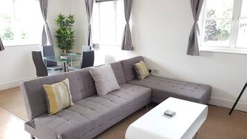 Apartment, 2 Bedrooms | Living room | Flat-screen TV