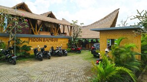 A building with a thatched roof and a sign reading "MOONBAMBOO". - Moon Bamboo (Pererenan)