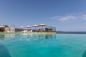 Seasonal outdoor pool, pool umbrellas, sun loungers